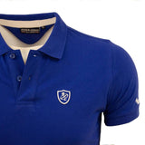 Polo bleu Blacks Legend / Peter Mc Andrew (zoom poitrine)