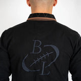 Polo noir manches longues brodé d'un ballon de rugby BACK to LEGEND (vue de dos)