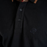 Polo noir manches longues brodé d'un ballon de rugby BACK to LEGEND (zoom poitrine)