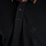 Polo noir manches longues brodé d'un ballon de rugby BACK to LEGEND (zoom poitrine)