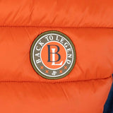 Doudoune sans manches orange BACK TO LEGEND (zoom badge)