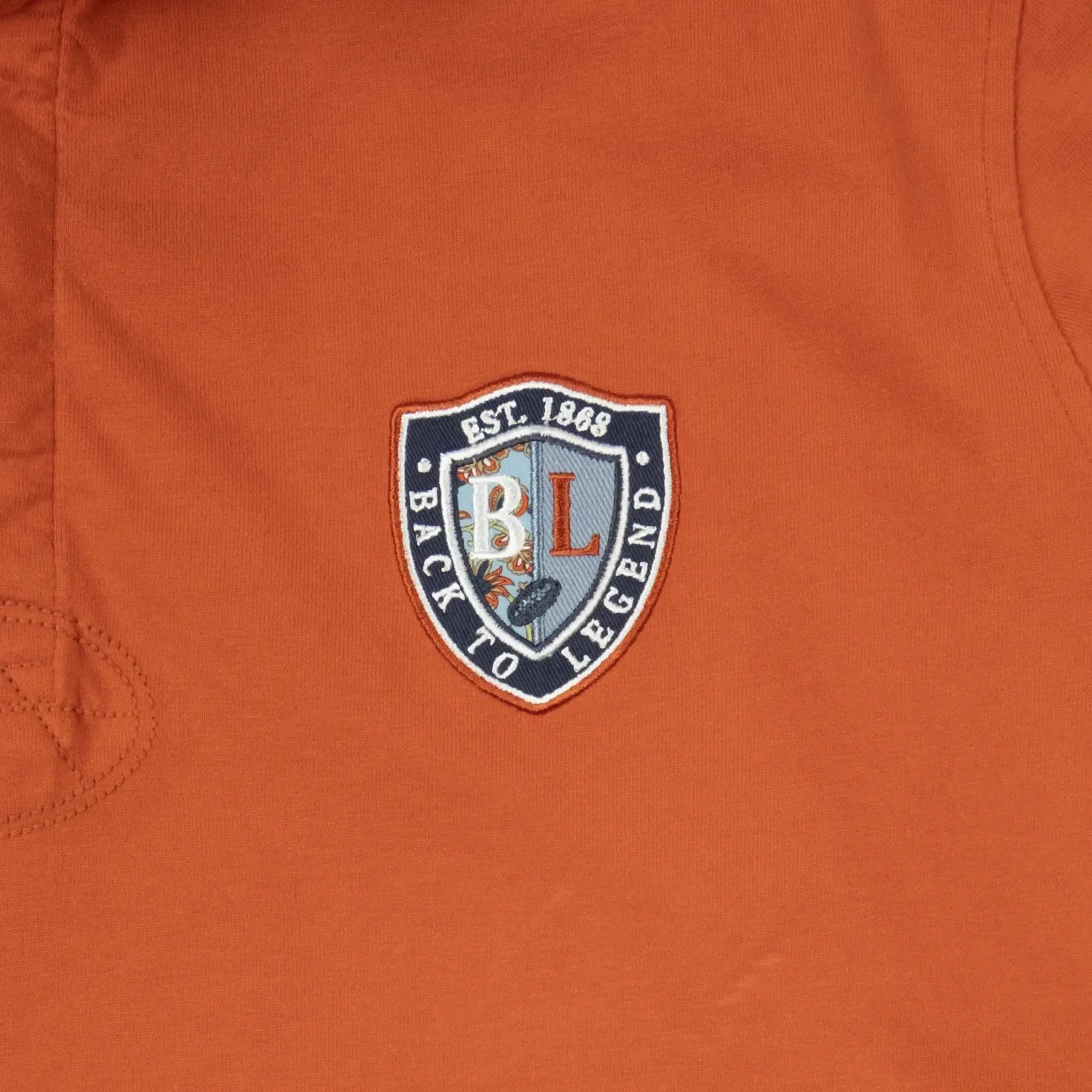 Polo orange à manches longues toucher peau de pêche BACK TO LEGEND (zoom écusson signature)