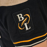 Polo scapulaire beige et noir Barbarians BACK to LEGEND (zoom manche droite)